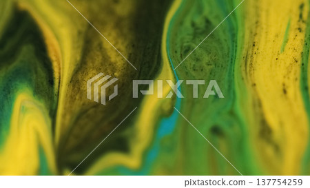 Defocused mix flow. Ink texture. Yellow green blue paint liquid acrylic splash bright fluid particles spill on abstract art background. Defocused mix flow. Ink texture. Yellow green blue paint liquid acrylic splash bright fluid particles spill on abstract art background. 137754259