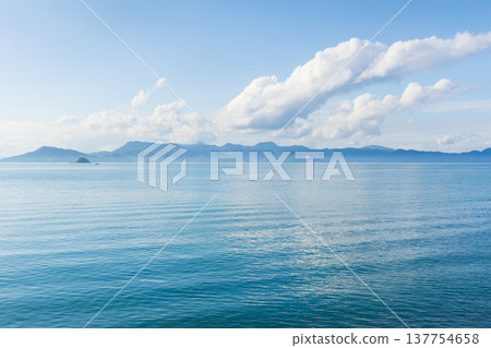The scenic views from the windows of the Hisatsu Orange Railway, a breathtaking railway line in Kyushu, overlooking the Yatsushiro Sea. 137754658