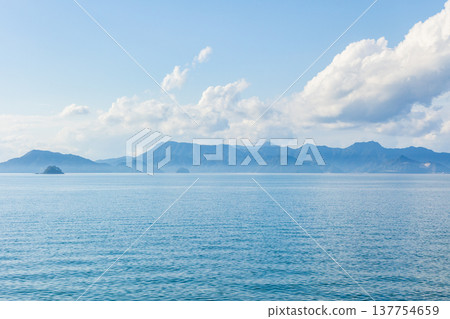 The scenic views from the windows of the Hisatsu Orange Railway, a breathtaking railway line in Kyushu, overlooking the Yatsushiro Sea. 137754659