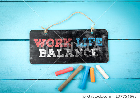 Work-Life Balance Chalkboard Sign On Blue Wooden Background Work-Life Balance Chalkboard Sign On Blue Wooden Background 137754663