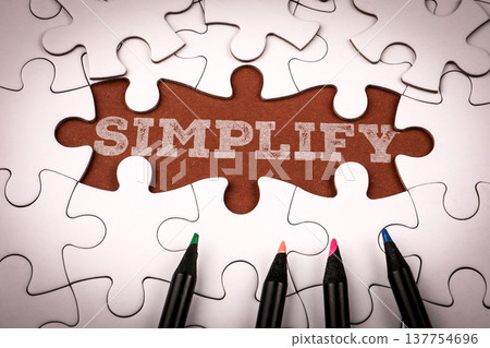 Simplicity Text On Brown Puzzle Piece Background 137754696
