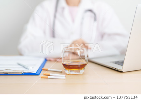 doctor hand making stop sign to refuse whiskey and breaking cigarette, quit smoking and drinking for healthy liver and lung, World No Tobacco and No Alcohol Day and stop alcohol addiction concept doctor hand making stop sign to refuse whiskey and breaking cigarette, quit smoking and drinking for healthy liver and lung, World No Tobacco and No Alcohol Day and stop alcohol addiction concept 137755134