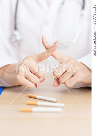 doctor hand making stop sign to refuse and breaking cigarette, quitting smoking for healthy lungs, prevent Lung Cancer and Emphysema, World No Tobacco Day concept 137755138