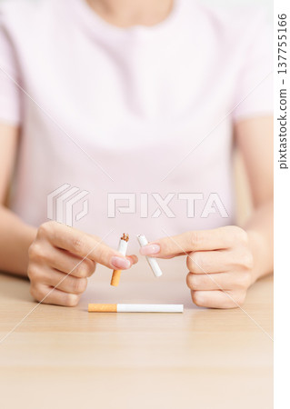 woman hand break cigarette for World No Tobacco Day concept, quitting smoking to prevent Lung Cancer, COPD, Emphysema and Tuberculosis disease. healthy lifestyle resolution, stop nicotine addiction woman hand break cigarette for World No Tobacco Day concept, quitting smoking to prevent Lung Cancer, COPD, Emphysema and Tuberculosis disease. healthy lifestyle resolution, stop nicotine addiction 137755166