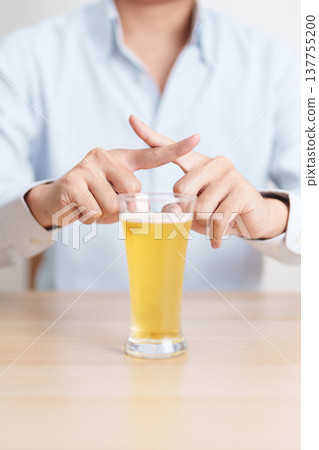 man making stop hand gesture to refuse a glass of Beer, Healthy man say no to alcohol drink, stop alcoholism and addiction concept. Responsible man reject a drink before driving and quit booze man making stop hand gesture to refuse a glass of Beer, Healthy man say no to alcohol drink, stop alcoholism and addiction concept. Responsible man reject a drink before driving and quit booze 137755200