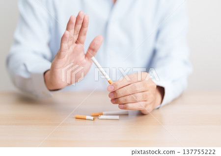 hand refuse to cigarette for World No Tobacco Day concept, quitting smoking to prevent Lung Cancer, COPD, Emphysema and Tuberculosis disease. healthy lifestyle resolution, stop nicotine addiction hand refuse to cigarette for World No Tobacco Day concept, quitting smoking to prevent Lung Cancer, COPD, Emphysema and Tuberculosis disease. healthy lifestyle resolution, stop nicotine addiction 137755222