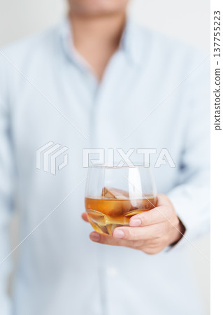 man with glass of cognac, suffering from alcohol addiction and alcoholism concept. depicting emotional distress, depression, substance abuse problem, unhealthy lifestyle and mental health man with glass of cognac, suffering from alcohol addiction and alcoholism concept. depicting emotional distress, depression, substance abuse problem, unhealthy lifestyle and mental health 137755223