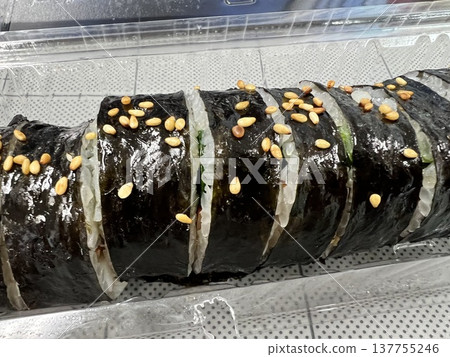 Kimbap, a Korean seaweed roll served in a plastic container. Kimbap, a Korean seaweed roll served in a plastic container. 137755246