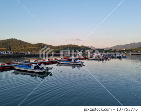 This is a view of an island village at sunset. This is a view of an island village at sunset. 137755770