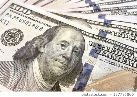 US 100 Dollar Bills Close-up. Detailed view of scattered hundred dollar banknotes. US 100 Dollar Bills Close-up. Detailed view of scattered hundred dollar banknotes. 137755866
