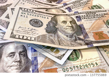 US 100 Dollar Bills Close-up. Detailed view of scattered hundred dollar banknotes. US 100 Dollar Bills Close-up. Detailed view of scattered hundred dollar banknotes. 137755869