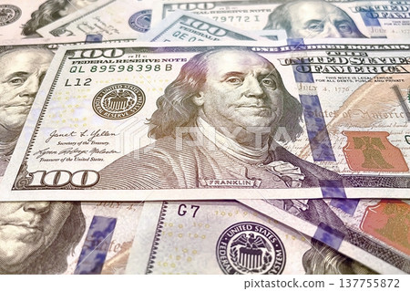 US 100 Dollar Bills Close-up. Detailed view of scattered hundred dollar banknotes. US 100 Dollar Bills Close-up. Detailed view of scattered hundred dollar banknotes. 137755872