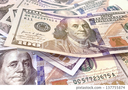 US 100 Dollar Bills Close-up. Detailed view of scattered hundred dollar banknotes. US 100 Dollar Bills Close-up. Detailed view of scattered hundred dollar banknotes. 137755874