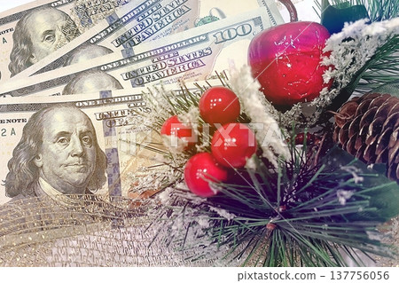 Christmas Cash and Holiday Decorations. $100 dollar bills with festive ornaments. Perfect for holiday budget, bonus, and shopping concepts. 137756056