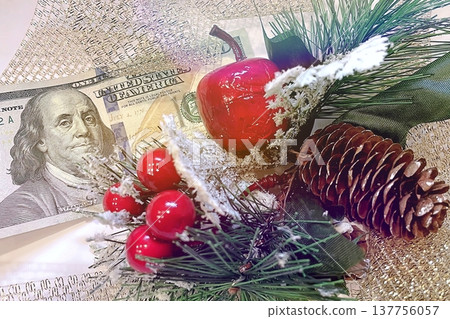 Christmas Cash and Holiday Decorations. $100 dollar bills with festive ornaments. Perfect for holiday budget, bonus, and shopping concepts. 137756057