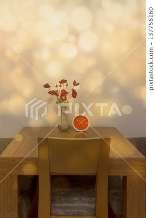 A warm interior with red poppies and an orange clock. A warm, minimalist look featuring flowers and a modern clock against a gold bokeh background. Perfect for lifestyle decor. 137756160