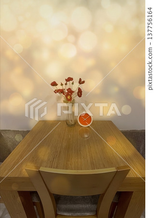 A warm interior with red poppies and an orange clock. A warm, minimalist look featuring flowers and a modern clock against a gold bokeh background. Perfect for lifestyle decor. 137756164