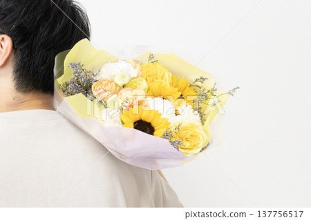 Dad holding a bouquet for Father's Day Dad holding a bouquet for Father's Day 137756517
