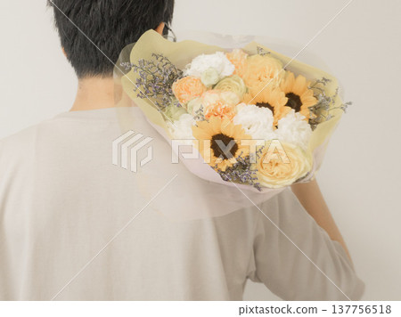 Dad holding a bouquet for Father's Day Dad holding a bouquet for Father's Day 137756518