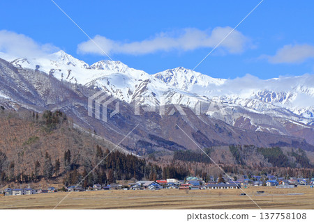 Early spring in Hakuba: The Hakuba Three Peaks viewed from the foot of the mountain. Early spring in Hakuba: The Hakuba Three Peaks viewed from the foot of the mountain. 137758108