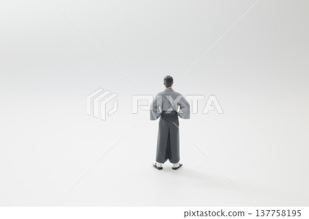 Traditional Garment Figurine Viewed from Clean Minimalist Background 137758195