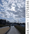 A scene from Kasama Art Forest Park in Ibaraki Prefecture: sunlight shining through the clouds on the walking path and against the winter sky. 137758346