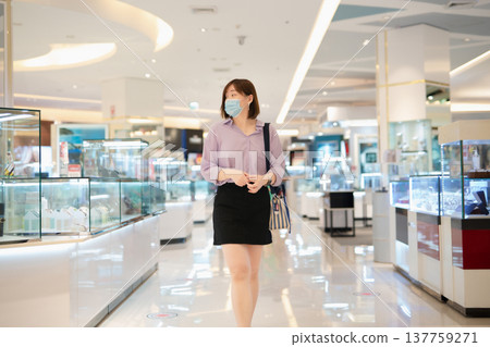asian business woman shopping at mall during sale and discount with wear protective mask asian business woman shopping at mall during sale and discount with wear protective mask 137759271
