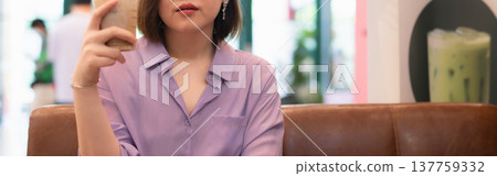 asian business woman drinking coffee at outdoor of coffee shop asian business woman drinking coffee at outdoor of coffee shop 137759332