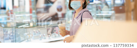 asian business woman shopping at mall during sale and discount with wear protective mask asian business woman shopping at mall during sale and discount with wear protective mask 137759334