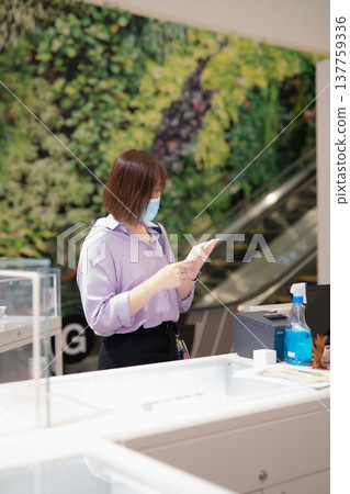 asian business woman shopping at mall during sale and discount with wear protective mask asian business woman shopping at mall during sale and discount with wear protective mask 137759336