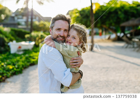 Father with young son in tropical beach resort. 137759338