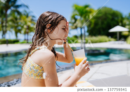 Diabetic girl during tropical beach vacation. 137759341