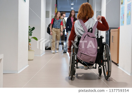 Teen students in school hallway, girl in wheelchair. 137759354