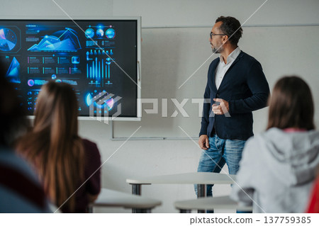 Science teacher teaching in high school classroom. 137759385