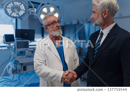 Doctor signing contract with pharmaceutical representative. Doctor signing contract with pharmaceutical representative. 137759544