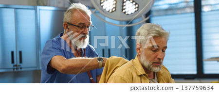 Doctor examining patient, listening to breathing with stethoscope. Doctor examining patient, listening to breathing with stethoscope. 137759634