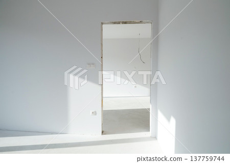 Empty doorway in unfinished apartment during home renovation. Empty doorway in unfinished apartment during home renovation. 137759744