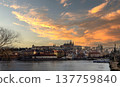 24 Feb 2026, Prague,Czech Republic. Stunning sunset view of Prague Castle and Vltava River in Prague, Czech Republic. Beautiful golden sky over the historic European city skyline at dusk 137759840