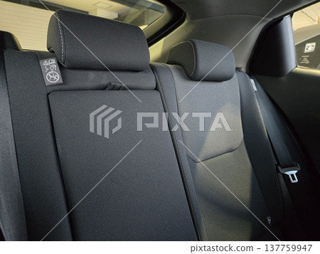 Close-up of the rear seat and headrest of a passenger car Close-up of the rear seat and headrest of a passenger car 137759947