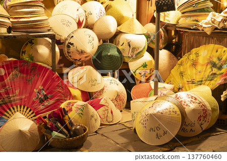 Traditional Vietnamese hats for sale at Hoi An night street market Traditional Vietnamese hats for sale at Hoi An night street market 137760460