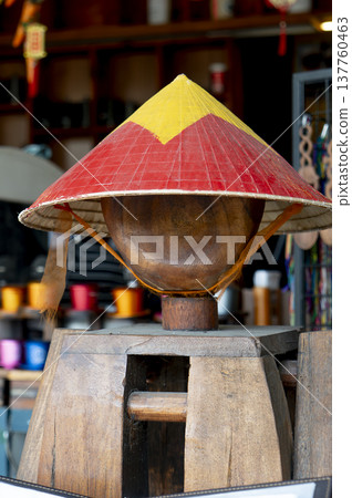 Vietnamese conical hat on wooden stand in traditional souvenir shop 137760463