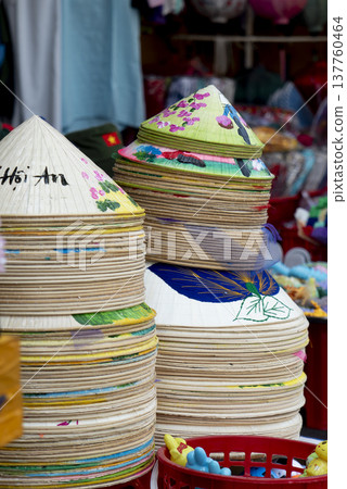 Stack of traditional Vietnamese conical hats for sale at Hoi An street market Stack of traditional Vietnamese conical hats for sale at Hoi An street market 137760464