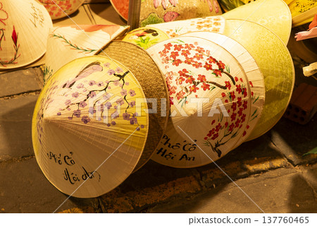 Traditional Vietnamese hats for sale at Hoi An night street market Traditional Vietnamese hats for sale at Hoi An night street market 137760465