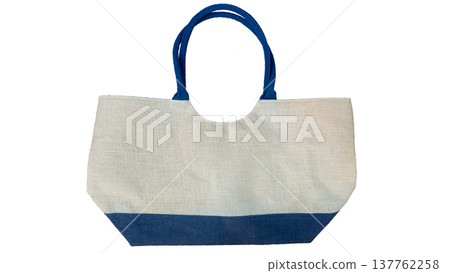 A bag made from linen fabric. The handles are blue, while the body of the bag is cream and blue. On isolated white background with clipping path. A bag made from linen fabric. The handles are blue, while the body of the bag is cream and blue. On isolated white background with clipping path. 137762258