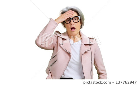 Senior woman remembering forgotten information with surprise expression 137762947