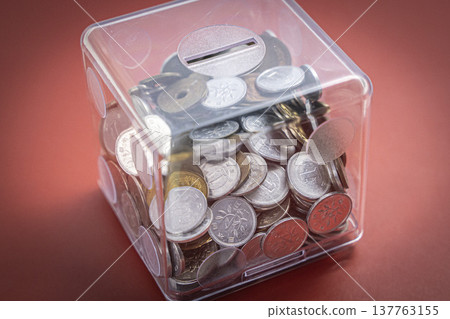 Coins in a case, Japanese yen piggy bank 137763155