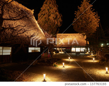 A wintertime view of Gero Gassho Village, a popular tourist spot in Gifu Prefecture, Japan, featuring the night sky and stars. A wintertime view of Gero Gassho Village, a popular tourist spot in Gifu Prefecture, Japan, featuring the night sky and stars. 137763193