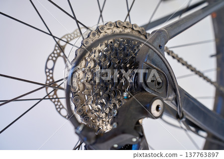 Bicycle drivetrain close up with cassette chain and disc brake Bicycle drivetrain close up with cassette chain and disc brake 137763897