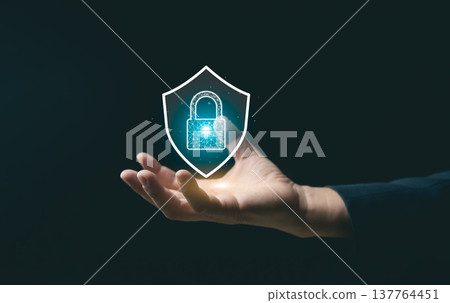 Hand Holding Digital Shield Icon Illustrating Security Protection with Lock Symbol for Cybersecurity and Data Privacy Concept Hand Holding Digital Shield Icon Illustrating Security Protection with Lock Symbol for Cybersecurity and Data Privacy Concept 137764451