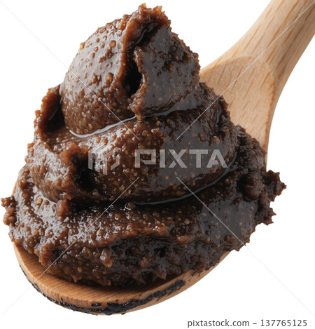 Scoop of dark brown organic miso paste on wooden spoon, showing its thick, textured, and rich fermented soybean paste with natural look Scoop of dark brown organic miso paste on wooden spoon, showing its thick, textured, and rich fermented soybean paste with natural look 137765125